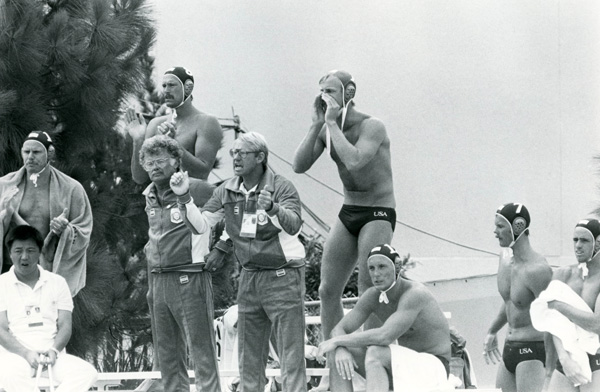 Players_and_coaches_urge_on_the_US_national_water_polo_team_during_an_Olympic_match_1984